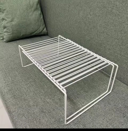 Expandable shelf raiser