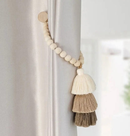 Magnetic &nbsp;curtain tie backs with wooden beads and tassel.