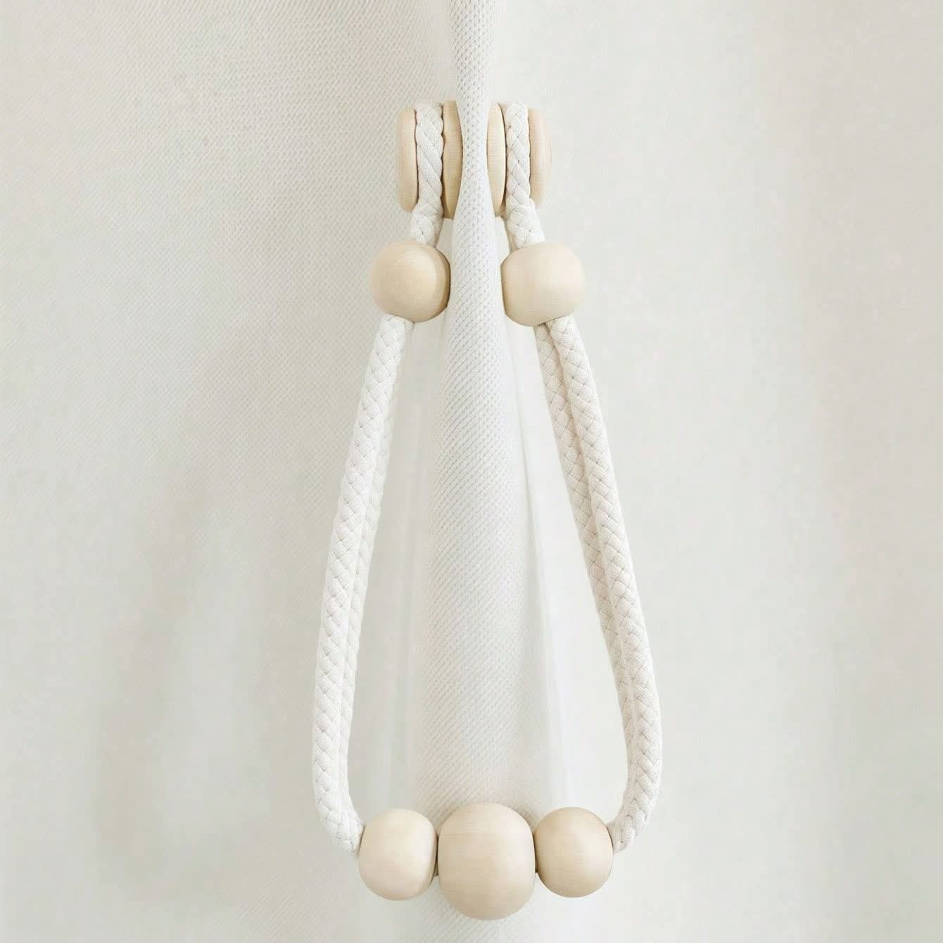 Magnetic curtain tie backs with wooden beads.