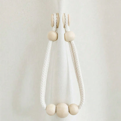 Magnetic curtain tie backs with wooden beads.